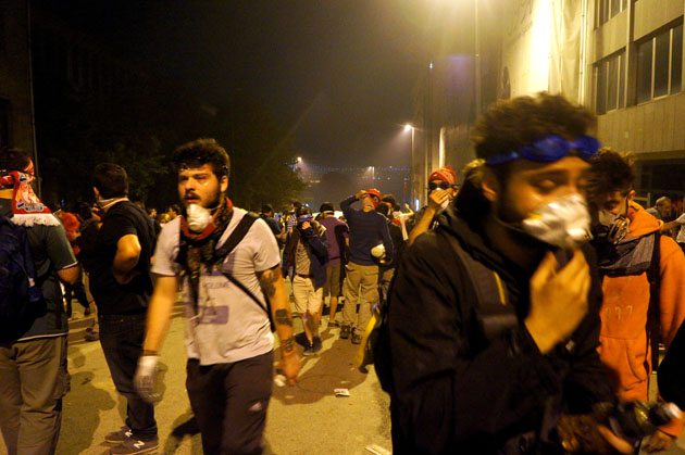 People with gas masks on in the street