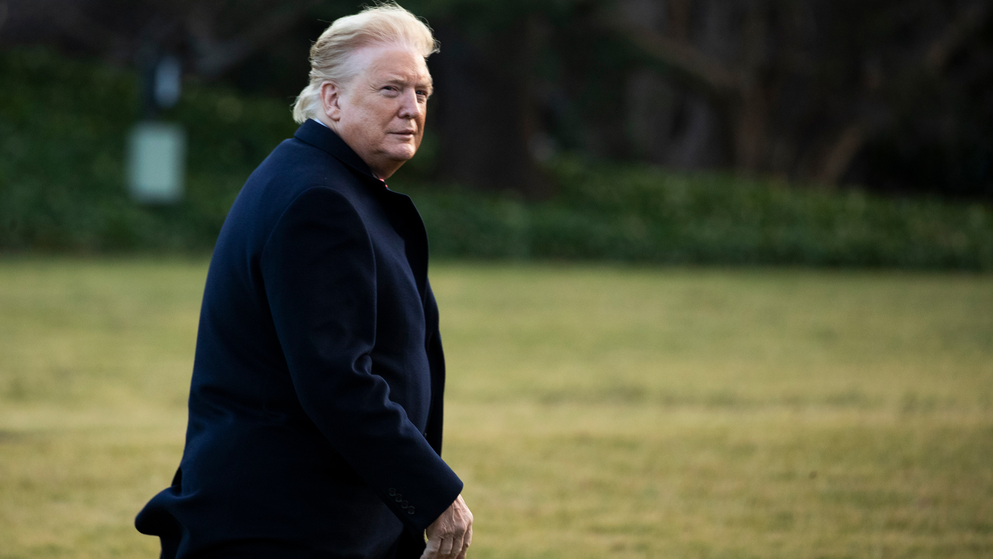 Trump Blames The Wind For Super Viral Photo But Says His Hair Still