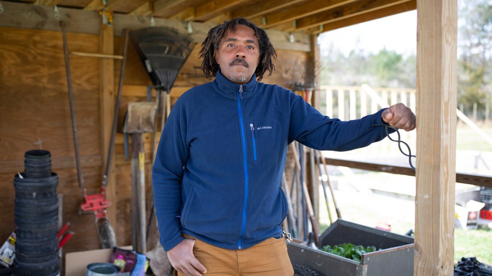 Tahz Walker stands on land that he and others own communally as part of Earthseed Land Collective in Durham, North Carolina on March 14, 2021. Walker and his partner Cristina Rivera-Chapman run Tierra Negra Farm which provides produce for farm shares as well as fresh vegetables to communities in downtown Durham.