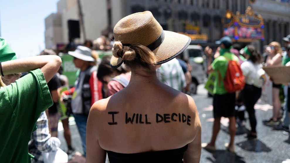 A with the words "I will decide" painted on her back.