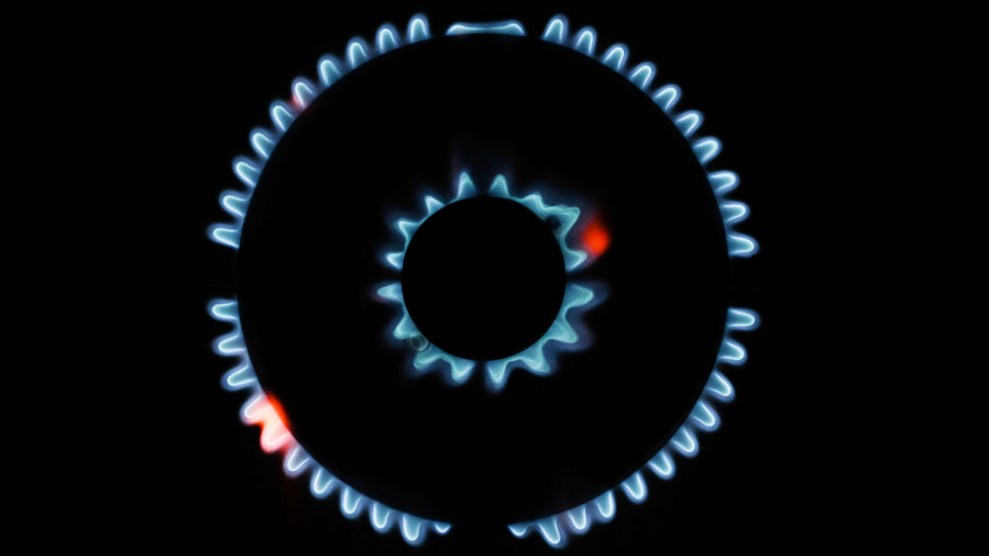 Flames are visible on a black gas stove
