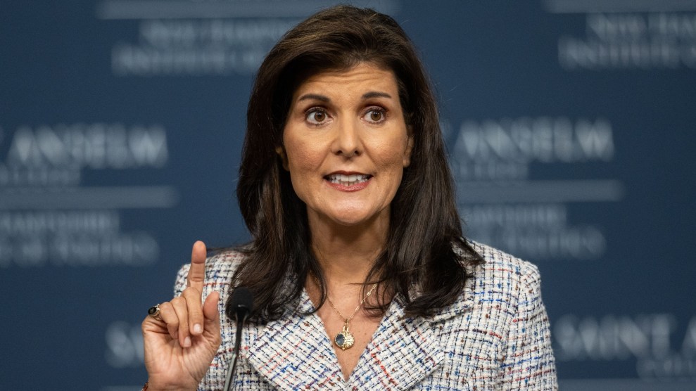 GOP presidential primary candidate Nikki Haley stands with one finger raised as to make a comment.