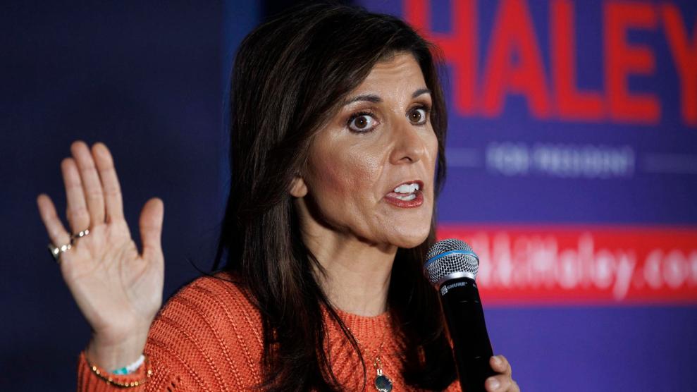 Nikki Haley speaking in front of a "Haley" poster in New Hampshire.