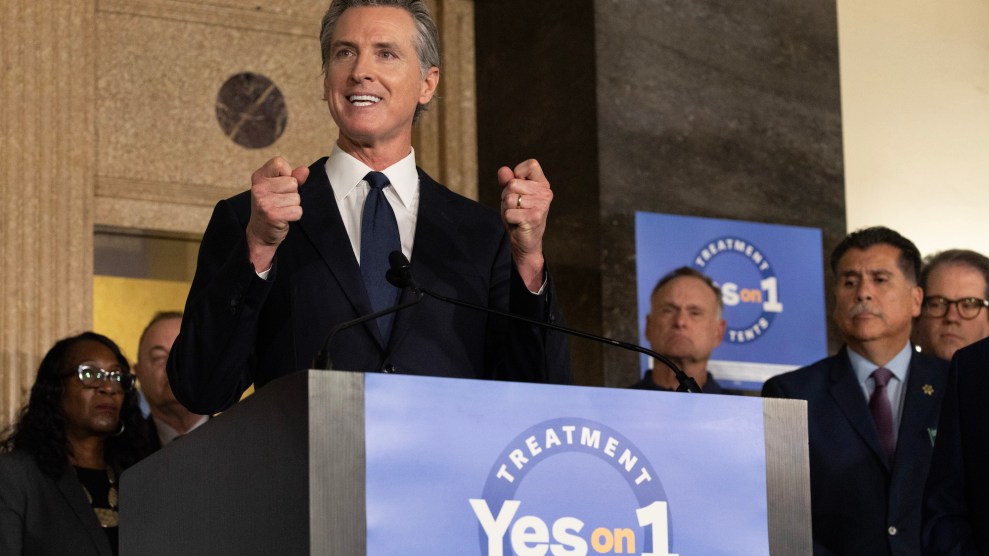 Gavin Newsom speaking at an event in front of a podium that says "Yes on 1"