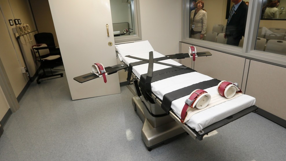 Department of Corrections officials are pictured in the witness room at right, outside the newly renovated death chamber at the Oklahoma State Penitentiary in McAlester, Okla