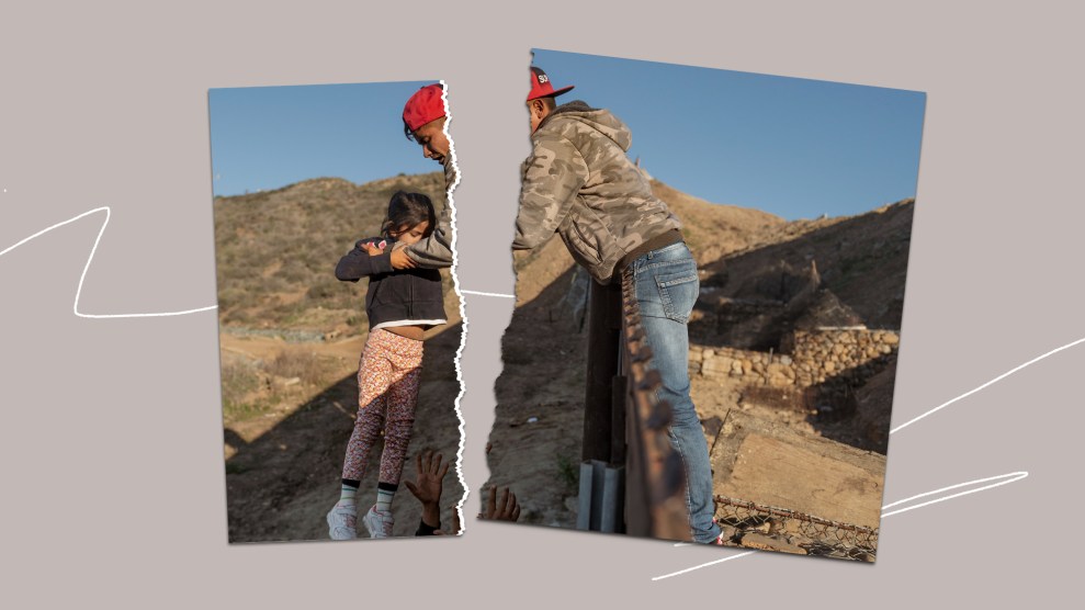 A torn photograph of a man handing a child over the U.S./Mexico border fence is torn in half, on a gray background.