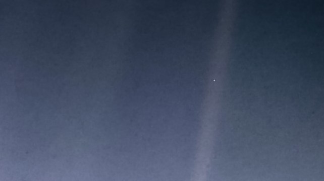 A small speck is visible in a beam of sunlight