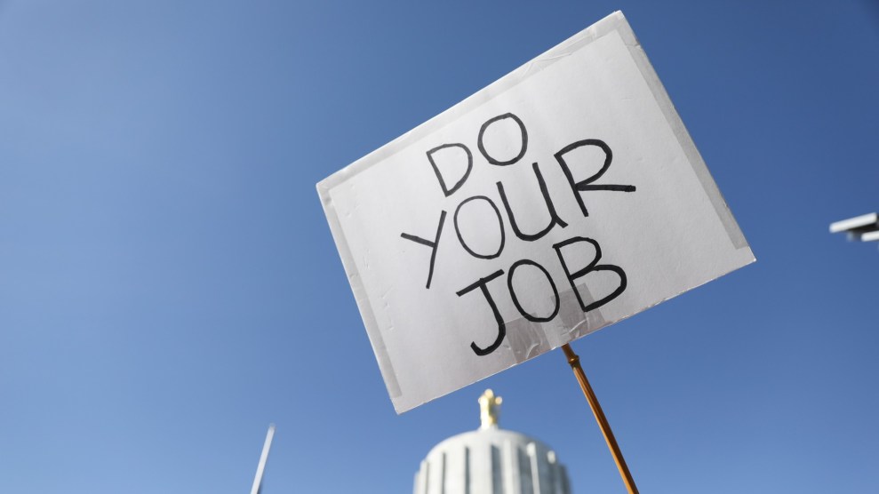 White sign with text "DO YOUR JOB"