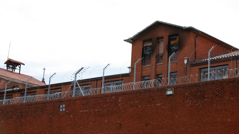 A prison, which is made of red brick and has red walls