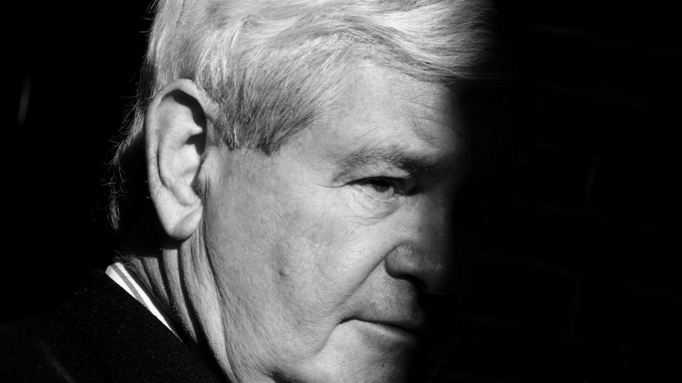 Tight portrait of Newt Gingrich with half his face in shadow.