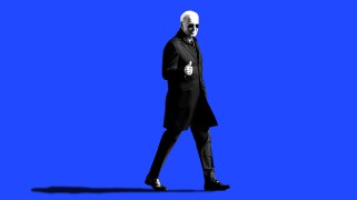 Black and white cutout of President Joe Biden, wearing aviator sunglasses and giving a thumbs up, on a blue background.