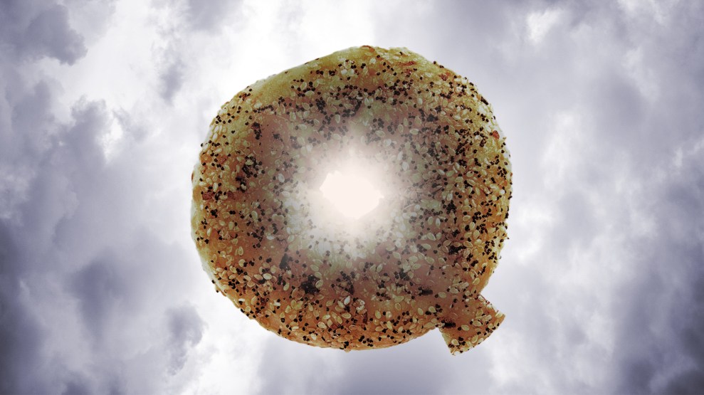 An illustration of an everything bagel, shaped like the letter Q, surrounded by grey clouds.