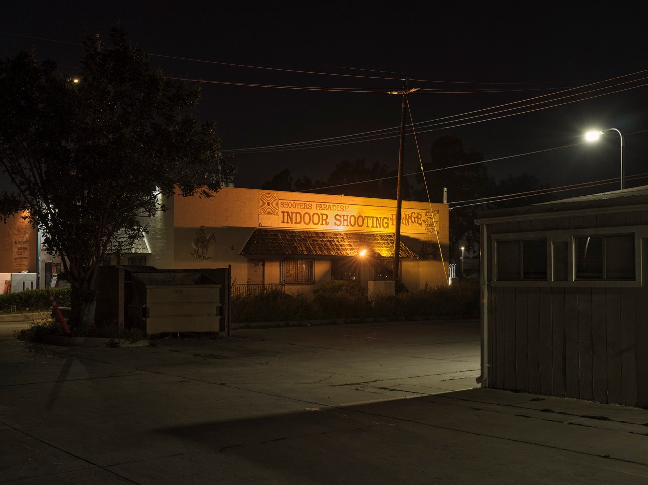 Night time image of the outside of a shooting range.