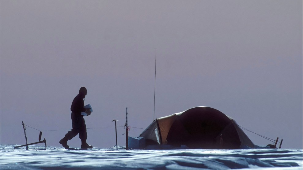 A figure walks across an icy landscape, barren except a tent