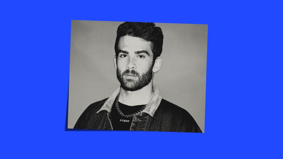 Portrait of Hasan Piker, a young, bearded man, on a blue background.