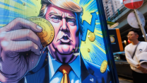 A colorful graphic novel-like illustrated poster shows Donald Trump holding a golden coin, as a passerby stands in the distance. In the illustration of Trump, golden light, coins, and arrows explode from around him in the background.