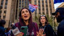 Laura Loomer seemingly yelling outside a building in New York City.