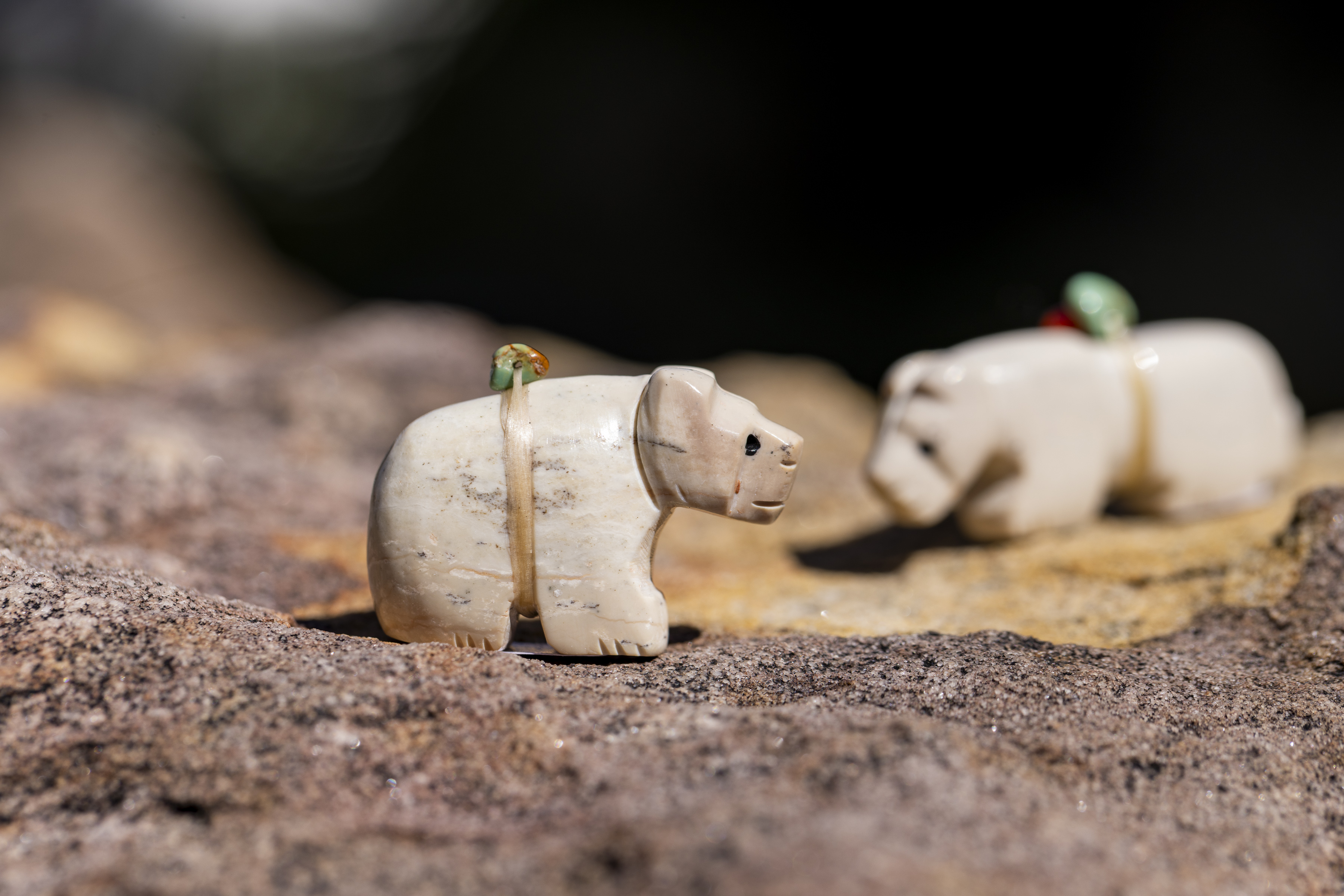 Two bear figurines facing each other