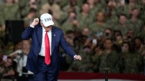 Trump in front of members of the military