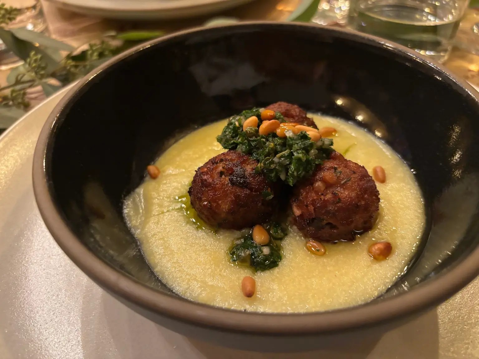 Meatballs on top of grits