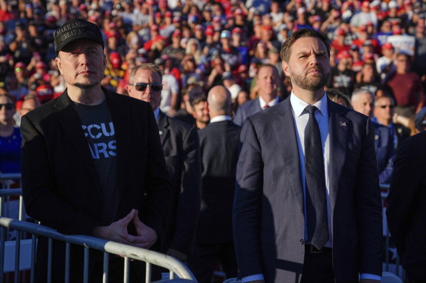 Elon Musk, left, and Republican vice presidential nominee Sen. JD Vance, R-Ohio, listen as Republican presidential nominee former President Donald Trump speaks at a campaign rally, Oct. 5, 2024, in Butler, Pa.