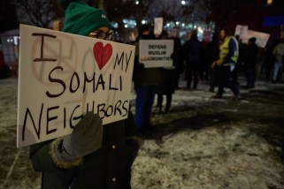 Community members and organizations associated with the Minnesota Free Palestine Coalition hold a rally in Minneapolis, Minnesota, on december 08, 2025, in response to recent federal rhetoric and policy actions affecting Somali and Afghan residents. A protestor holds a sign that says "I LOVE MY SOMALI NEIGHBORS."