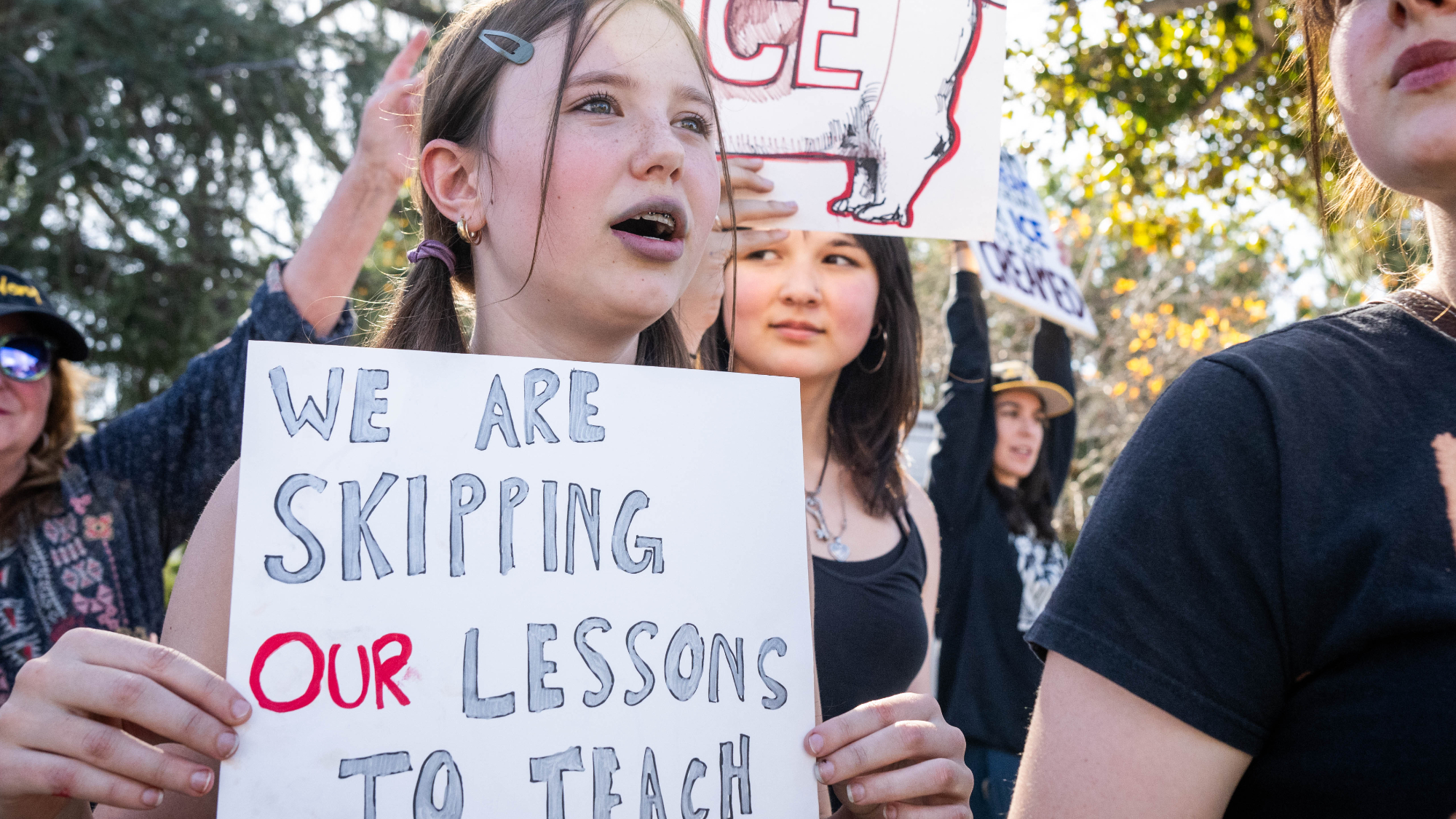 Augusta Cummins, 13, Robin Stromvall, 14, and Priscilla Cummins, 15, skip school to join a nationwide Ice Out of Everywhere protest at Pasadena City College, where a Fight Back Friday demonstration has been held for almost a year, on Friday, January 30, 2026.
