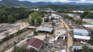 An aerial view of flooded, destroyed buildings.