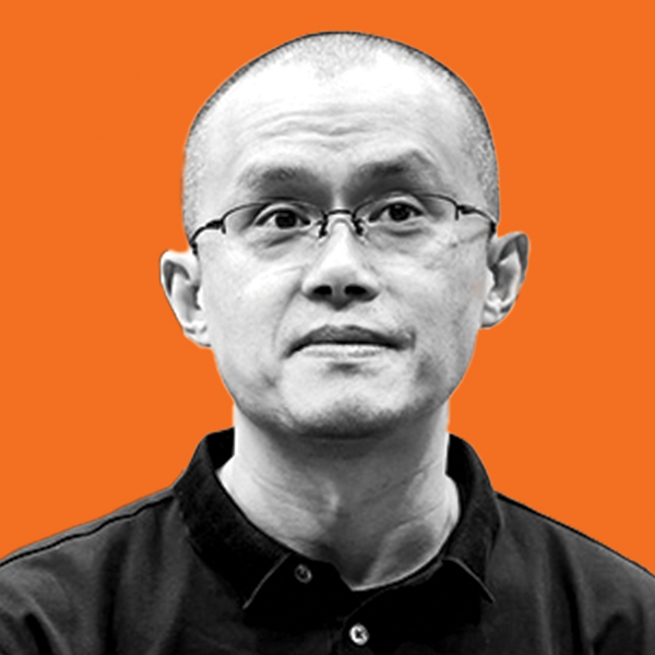 Black and white photo of a bespectacled Asian man with a shaved head. 