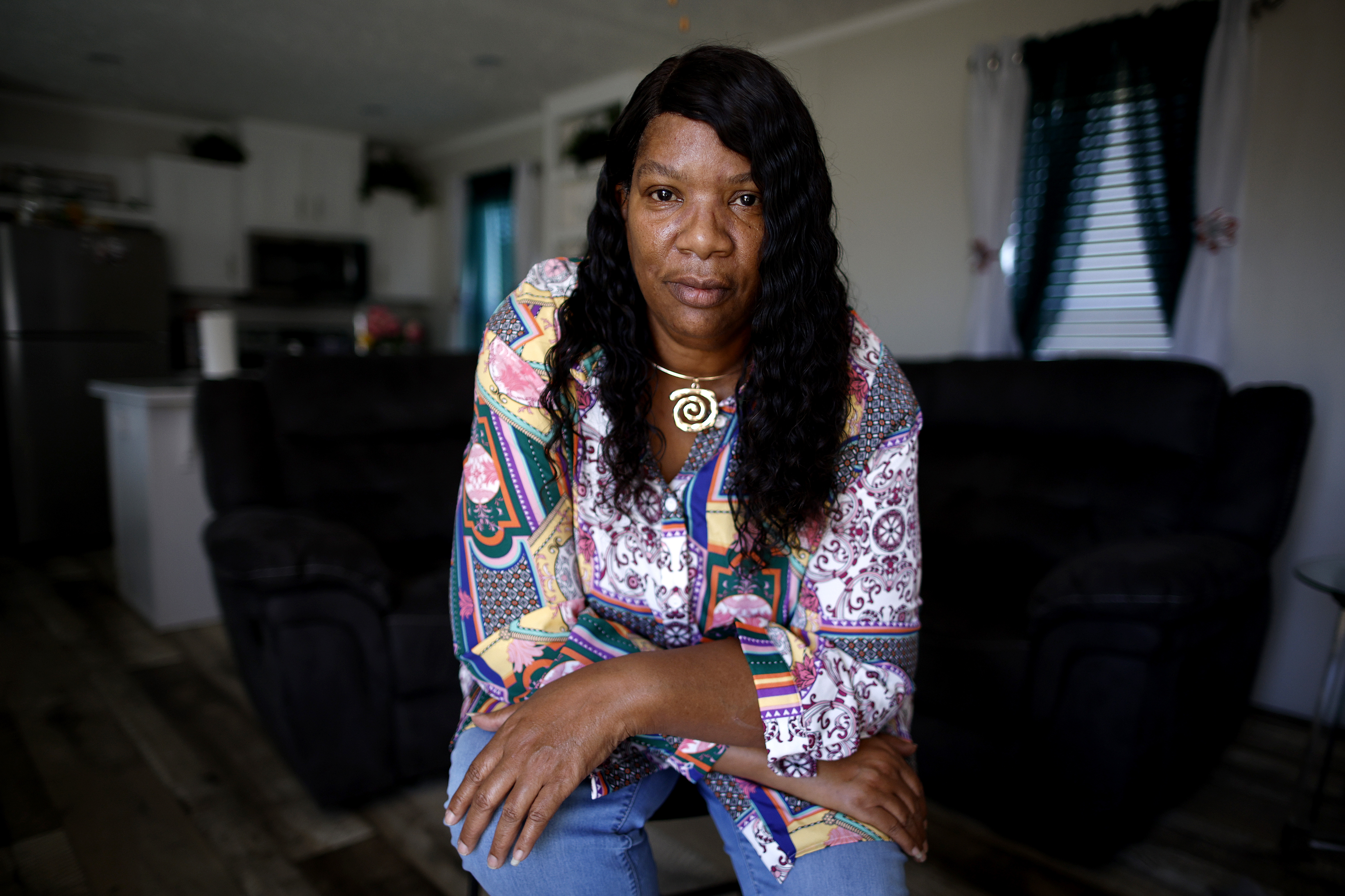 Twila Collins looks directly into the camera.