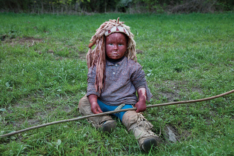 Baby dressed as Native American.