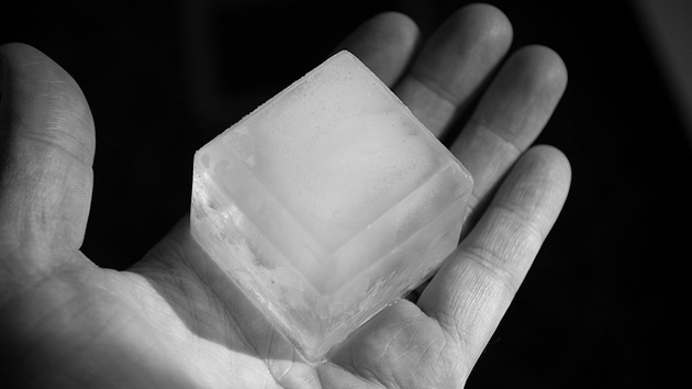 ice cube melting in hand